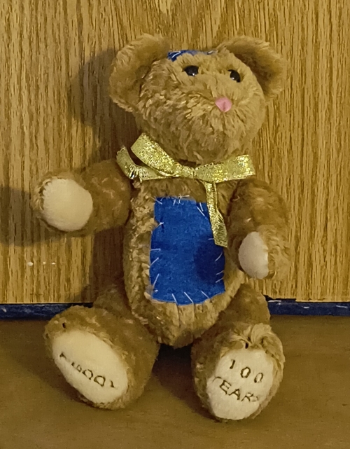 Patches Bear with blue belly patch and gold ribbon