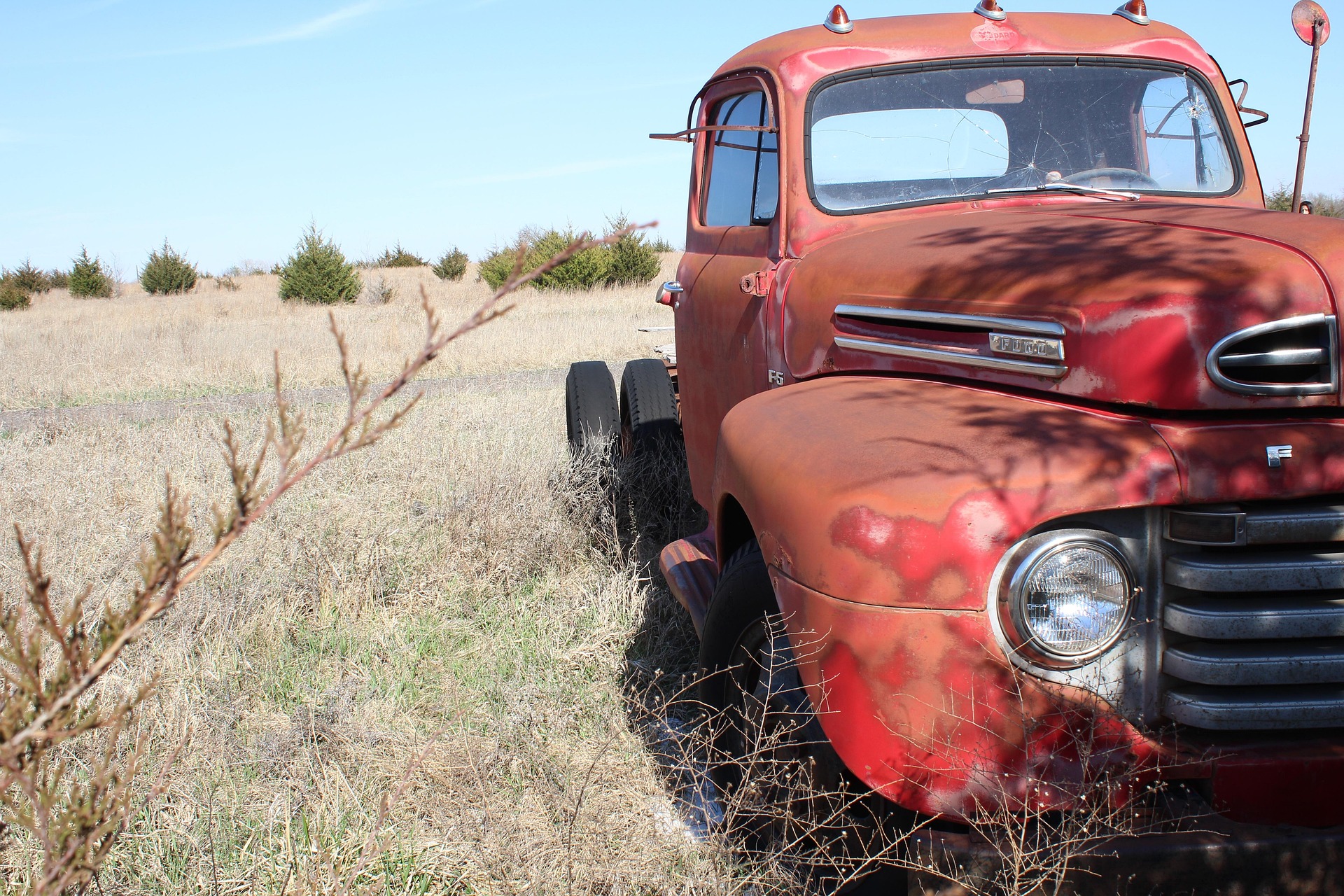 Old truck beside a country building