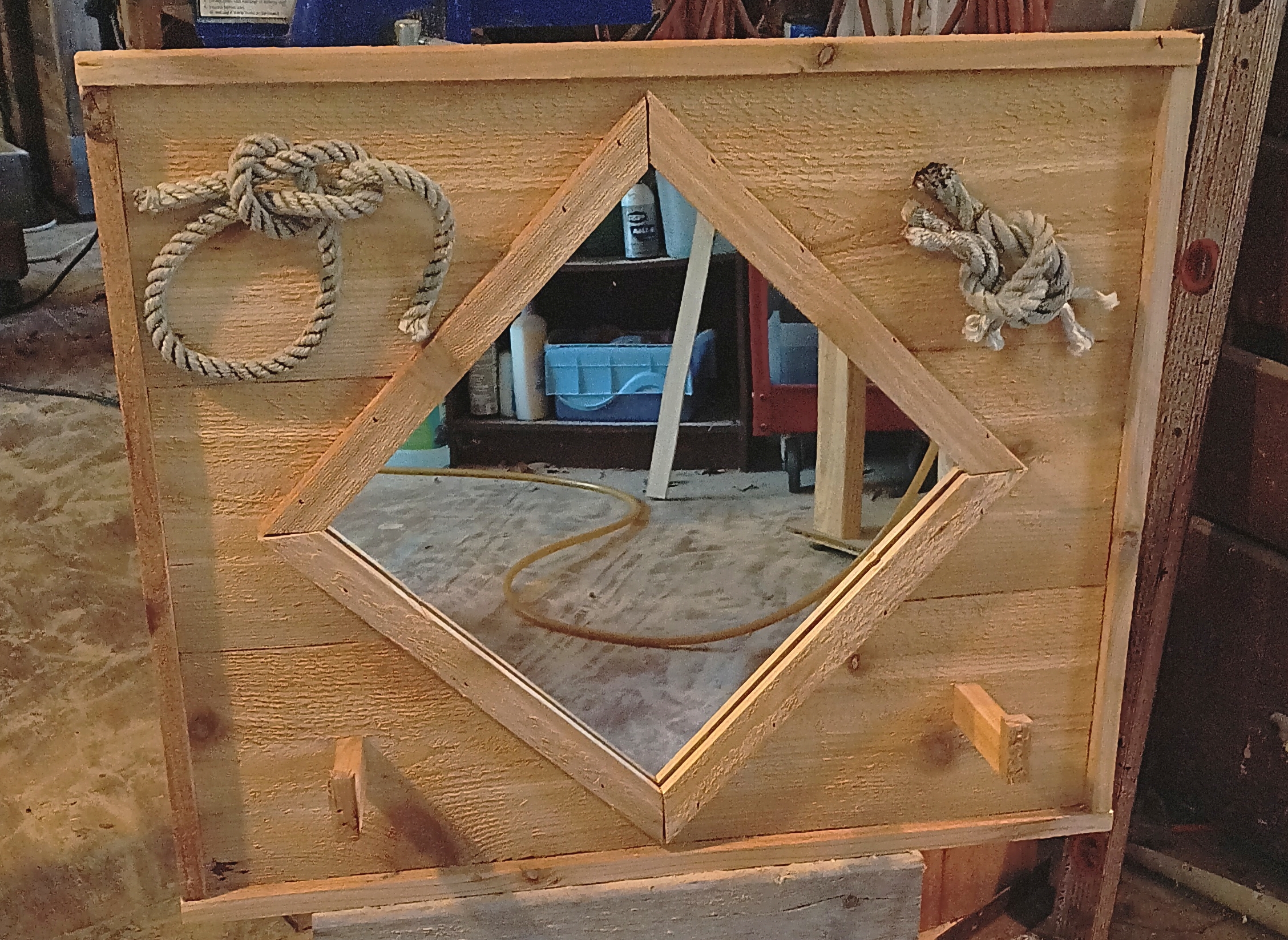 Decorative wooden wall mirror with hat holders